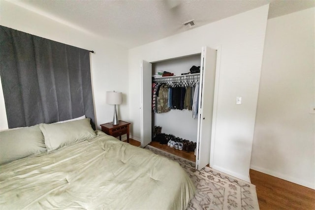 2616 NW 33rd St, Oklahoma City, OK 73112 - bedroom featuring a closet, wood finished floors, and baseboards