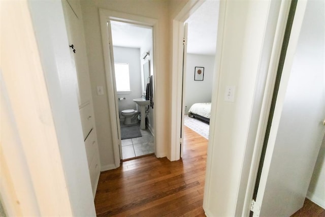 2616 NW 33rd St, Oklahoma City, OK 73112 - hallway featuring hardwood / wood-style flooring and a sink