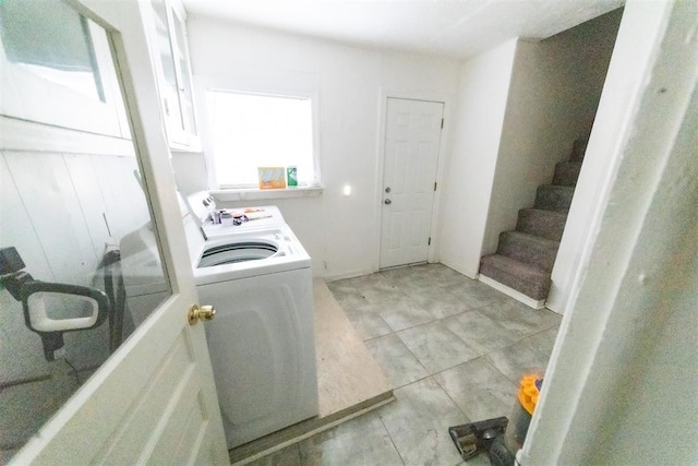 2616 NW 33rd St, Oklahoma City, OK 73112 - laundry room with washer / clothes dryer and light tile patterned floors