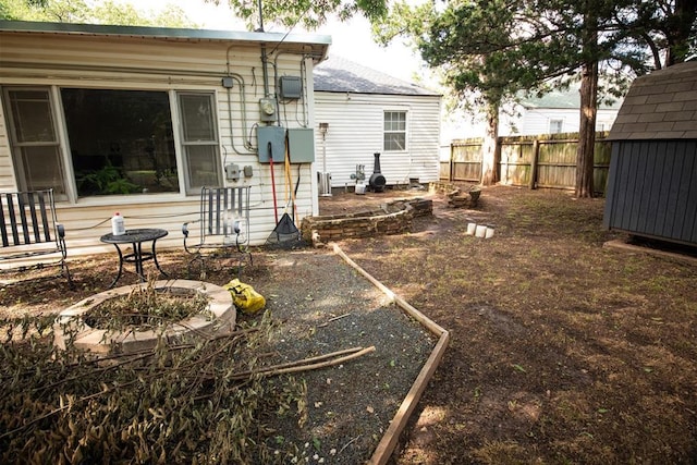 2616 NW 33rd St, Oklahoma City, OK 73112 - rear view of house featuring a fenced backyard and a shingled roof