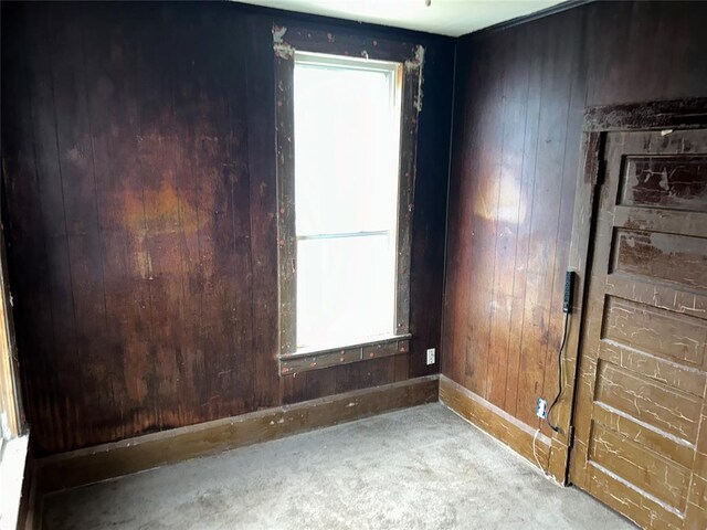 8312 Spencer Jones Rd, Jones, OK 73049 - unfurnished room featuring baseboards and wood walls