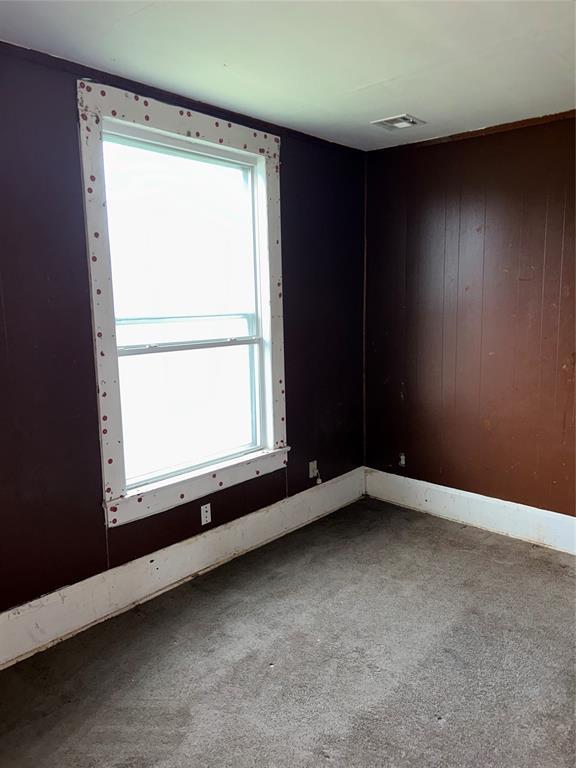 8312 Spencer Jones Rd, Jones, OK 73049 - carpeted empty room with baseboards