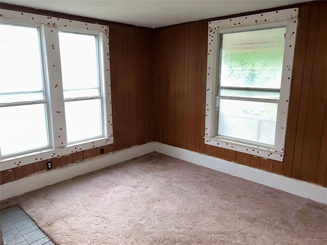 8312 Spencer Jones Rd, Jones, OK 73049 - unfurnished room featuring light carpet and wood walls