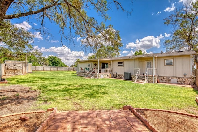 711 Sisson Ave, Sayre, OK 73662 - back of property with cooling unit, a patio, and crawl space