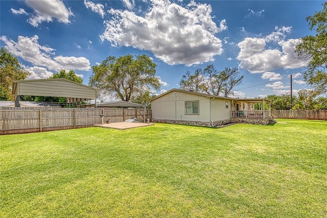 711 Sisson Ave, Sayre, OK 73662 - view of yard featuring a carport and a wooden deck