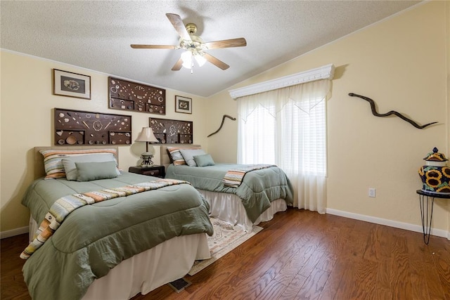 711 Sisson Ave, Sayre, OK 73662 - bedroom with a textured ceiling, baseboards, wood finished floors, lofted ceiling, and ceiling fan