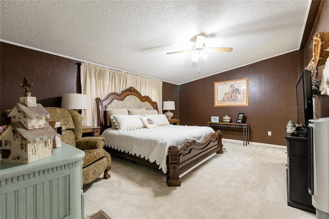 711 Sisson Ave, Sayre, OK 73662 - bedroom with a textured wall, a textured ceiling, light carpet, vaulted ceiling, and a ceiling fan