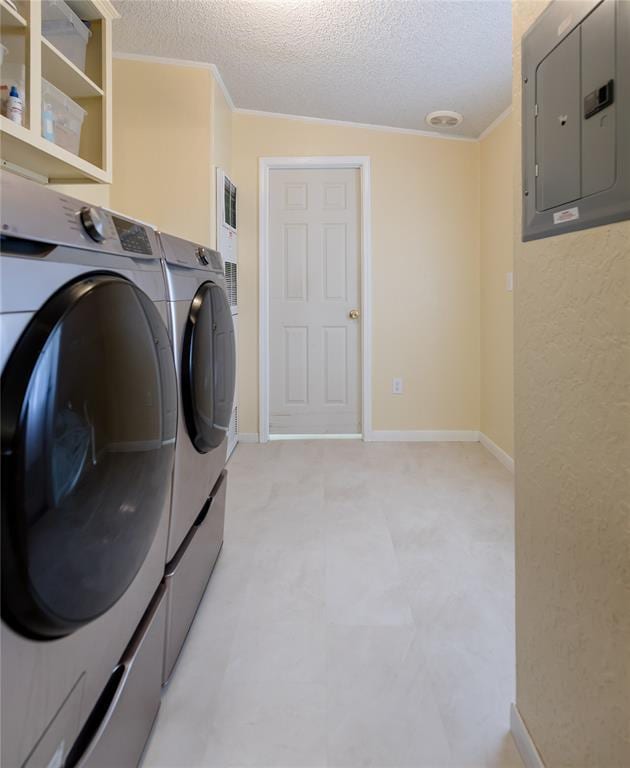 711 Sisson Ave, Sayre, OK 73662 - laundry room with electric panel, separate washer and dryer, a textured ceiling, baseboards, and ornamental molding