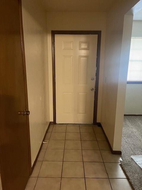 7716 S Charlotte Dr, Oklahoma City, OK 73159 - hall with baseboards and light tile patterned floors