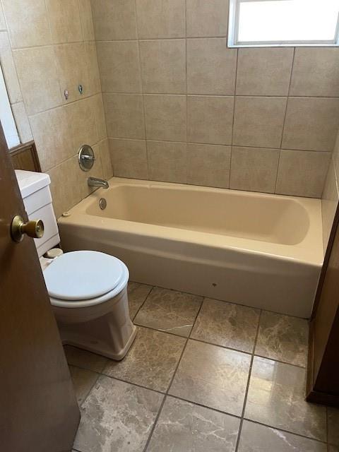 7716 S Charlotte Dr, Oklahoma City, OK 73159 - full bathroom featuring toilet, tile patterned flooring, and shower / tub combination