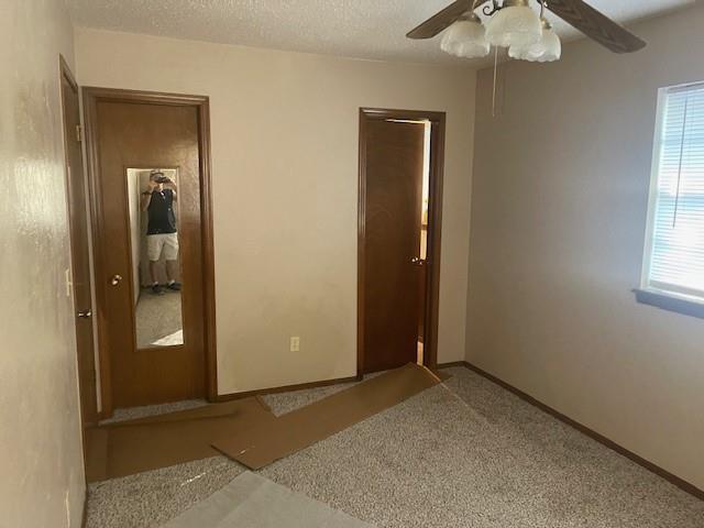7716 S Charlotte Dr, Oklahoma City, OK 73159 - spare room with a ceiling fan, carpet floors, and baseboards
