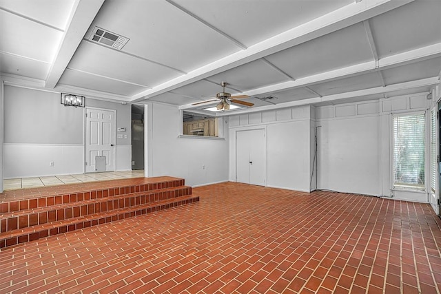 1016 E Cypress St, Altus, OK 73521 - basement featuring brick patterned floors and ceiling fan