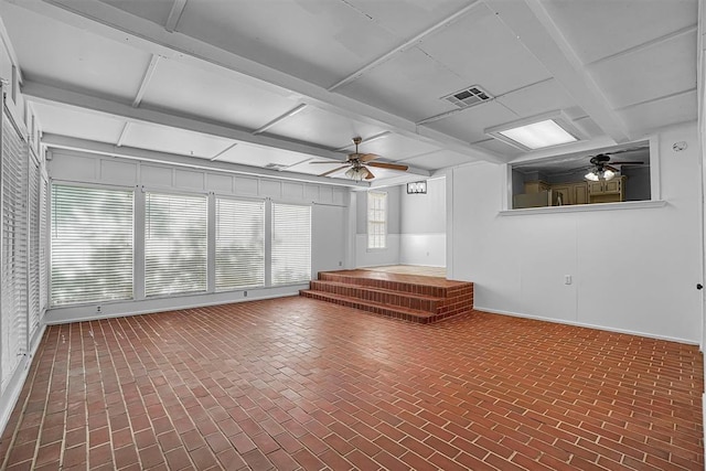 1016 E Cypress St, Altus, OK 73521 - below grade area featuring a ceiling fan and brick patterned flooring