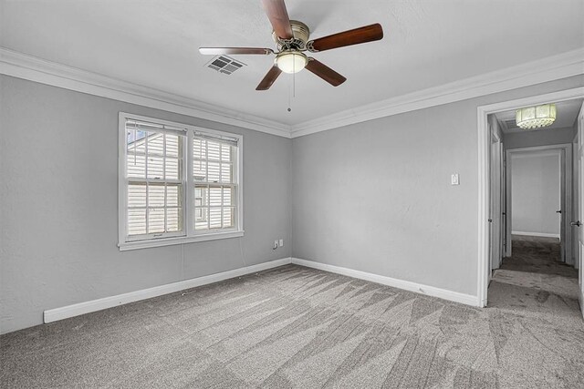 1016 E Cypress St, Altus, OK 73521 - carpeted spare room featuring ornamental molding, a ceiling fan, and baseboards