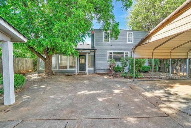 1016 E Cypress St, Altus, OK 73521 - rear view of house with a detached carport