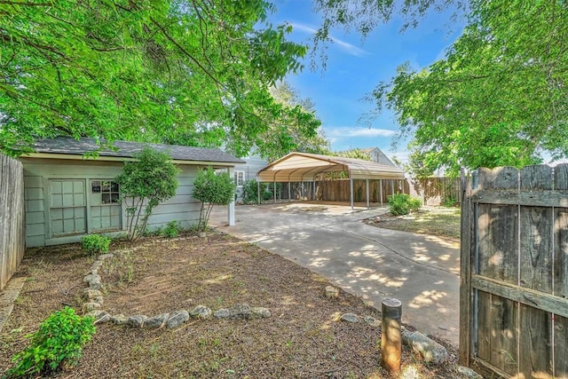 1016 E Cypress St, Altus, OK 73521 - view of yard with a detached carport and concrete driveway