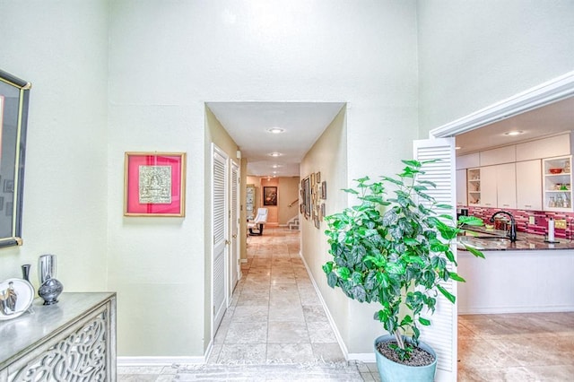 3605 Hampton Ct, Norman, OK 73072 - corridor featuring a sink, baseboards, and a towering ceiling