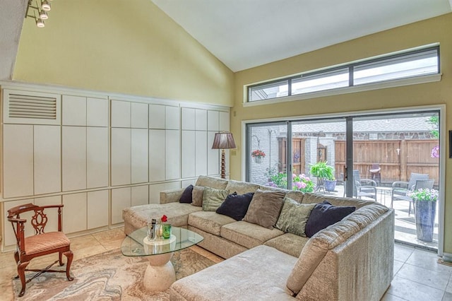 3605 Hampton Ct, Norman, OK 73072 - living room with high vaulted ceiling and tile patterned flooring