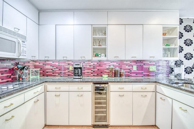 3605 Hampton Ct, Norman, OK 73072 - kitchen with wine cooler, white microwave, open shelves, stone counters, and decorative backsplash