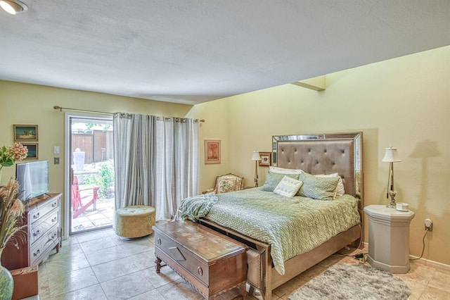 3605 Hampton Ct, Norman, OK 73072 - bedroom featuring access to exterior, light tile patterned floors, a textured ceiling, and baseboards
