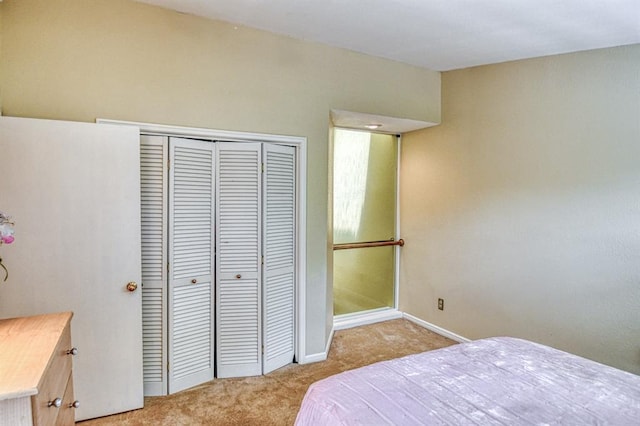 3605 Hampton Ct, Norman, OK 73072 - bedroom featuring light colored carpet, a closet, and baseboards