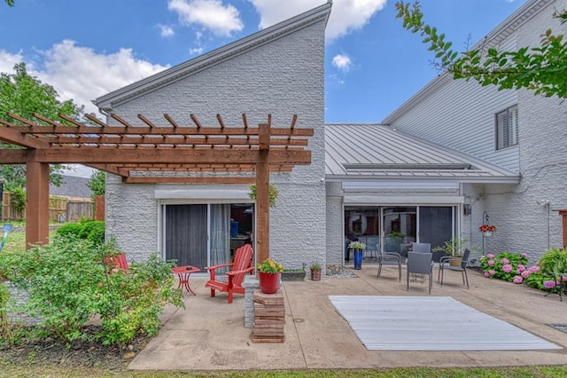 3605 Hampton Ct, Norman, OK 73072 - back of property with a standing seam roof, a patio area, a pergola, and metal roof