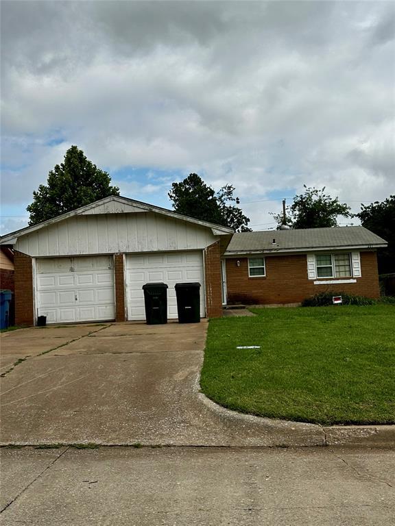 201 W Campbell Dr, Midwest City, OK 73110 - ranch-style home with a front lawn and brick siding