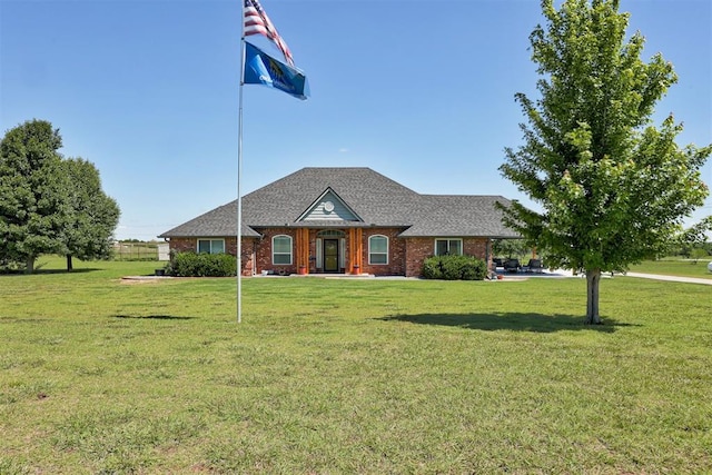 13131 SW 15th St, Yukon, OK 73099 - view of front of home featuring a front lawn and brick siding