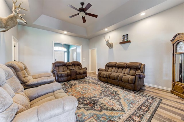 13131 SW 15th St, Yukon, OK 73099 - living area featuring a raised ceiling, a ceiling fan, wood finished floors, baseboards, and recessed lighting