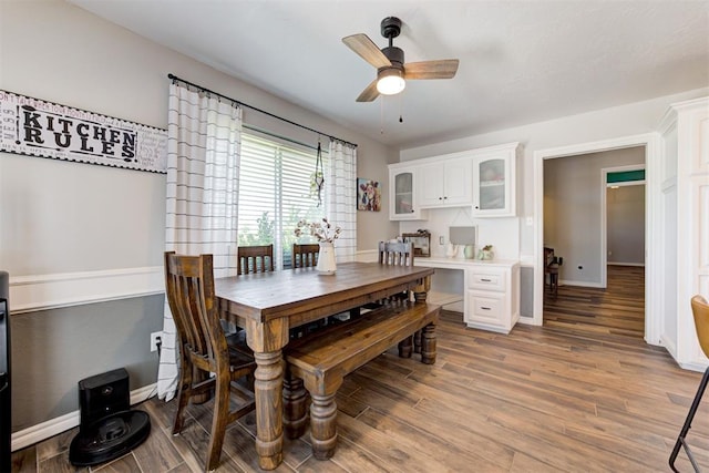13131 SW 15th St, Yukon, OK 73099 - dining room featuring wood finished floors, ceiling fan, and baseboards