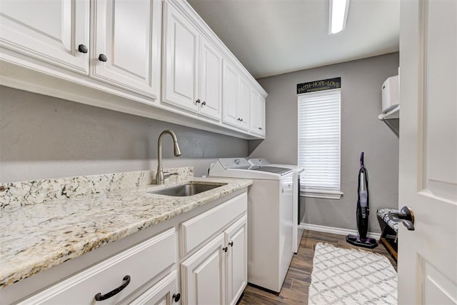 13131 SW 15th St, Yukon, OK 73099 - laundry room featuring washer and dryer, cabinet space, dark wood-type flooring, and baseboards