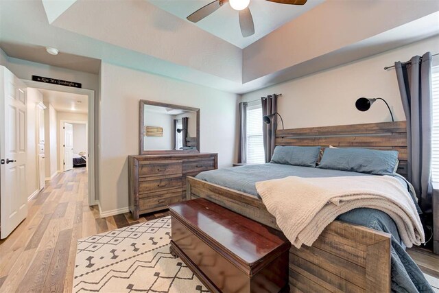 13131 SW 15th St, Yukon, OK 73099 - bedroom with light wood finished floors, baseboards, and ceiling fan