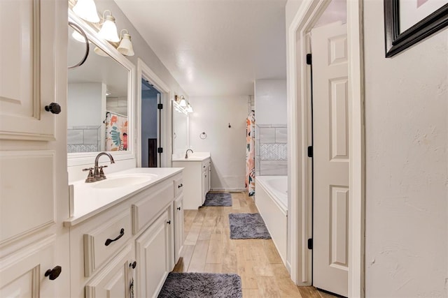 13131 SW 15th St, Yukon, OK 73099 - full bath featuring two vanities and wood finished floors