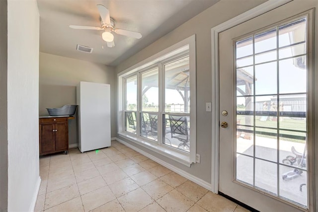 13131 SW 15th St, Yukon, OK 73099 - unfurnished dining area featuring baseboards and a ceiling fan