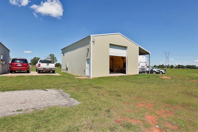 13131 SW 15th St, Yukon, OK 73099 - back of house featuring a garage, a yard, and an outdoor structure