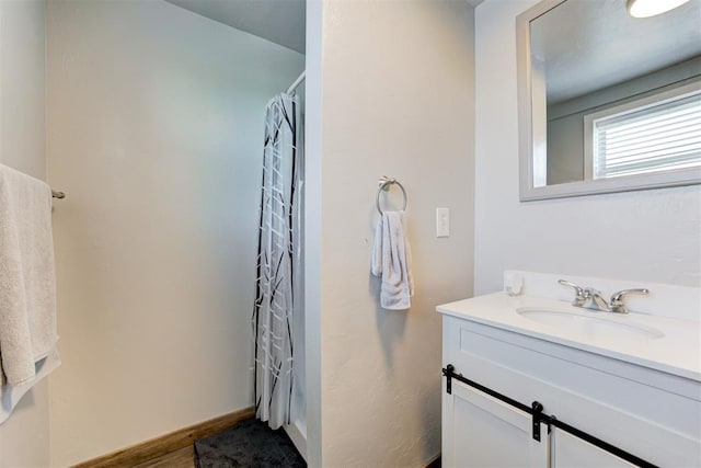13131 SW 15th St, Yukon, OK 73099 - full bathroom with vanity, a shower with curtain, and baseboards