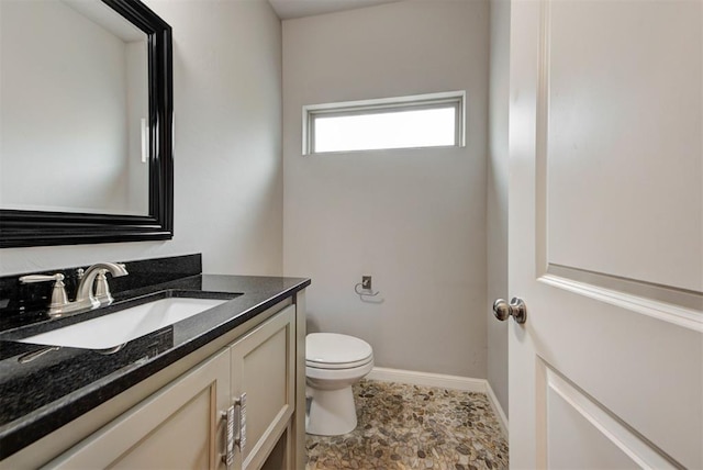 1440 Station St, Edmond, OK 73034 - bathroom with toilet, vanity, and baseboards
