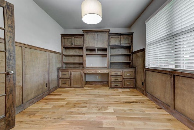 1440 Station St, Edmond, OK 73034 - unfurnished office featuring built in study area, light wood-style floors, and wainscoting