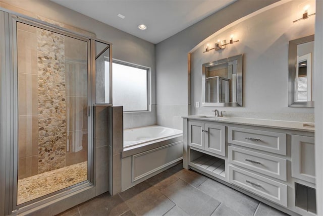 1440 Station St, Edmond, OK 73034 - full bath with a garden tub, vanity, a shower stall, and recessed lighting