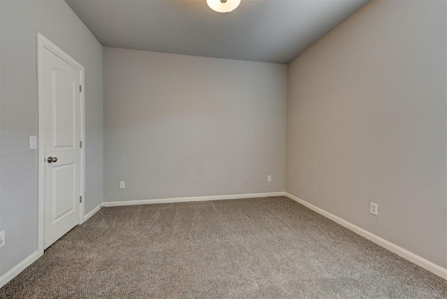 1440 Station St, Edmond, OK 73034 - spare room featuring carpet and baseboards