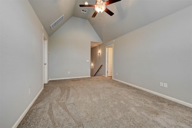 1440 Station St, Edmond, OK 73034 - spare room with a ceiling fan, lofted ceiling, carpet, and baseboards