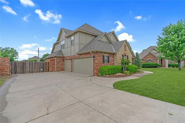 13605 Verona Strada, Oklahoma City, OK 73170 - view of home's exterior featuring a shingled roof, concrete driveway, board and batten siding, a garage, and brick siding