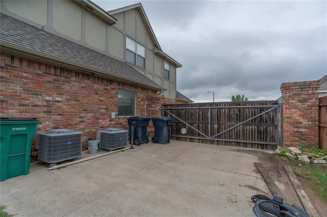 13605 Verona Strada, Oklahoma City, OK 73170 - view of patio / terrace with central AC and a gate
