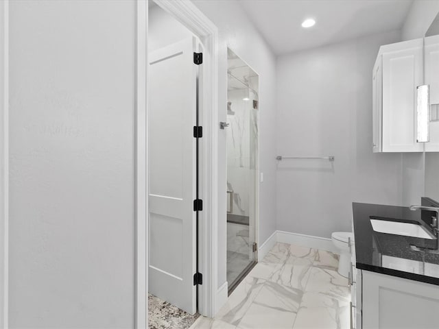 12901 Rivendell Dr, Oklahoma City, OK 73170 - bathroom with a marble finish shower, vanity, marble finish flooring, toilet, and baseboards