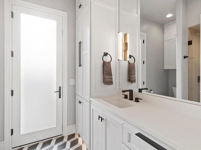 12901 Rivendell Dr, Oklahoma City, OK 73170 - bathroom with vanity, toilet, recessed lighting, and a shower