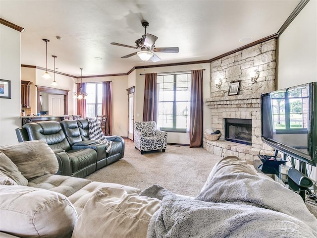 15228 Turtle Lake Pl, Oklahoma City, OK 73165 - carpeted living room featuring crown molding, a ceiling fan, a fireplace, and baseboards