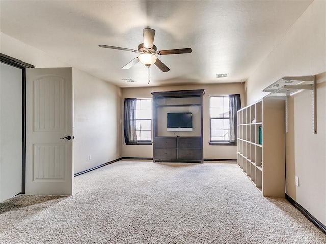 15228 Turtle Lake Pl, Oklahoma City, OK 73165 - unfurnished living room featuring carpet flooring, plenty of natural light, ceiling fan, and baseboards