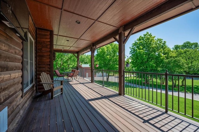 2801 John Deere Ave Unit 1, Edmond, OK 73034 - deck featuring a lawn and outdoor dining space