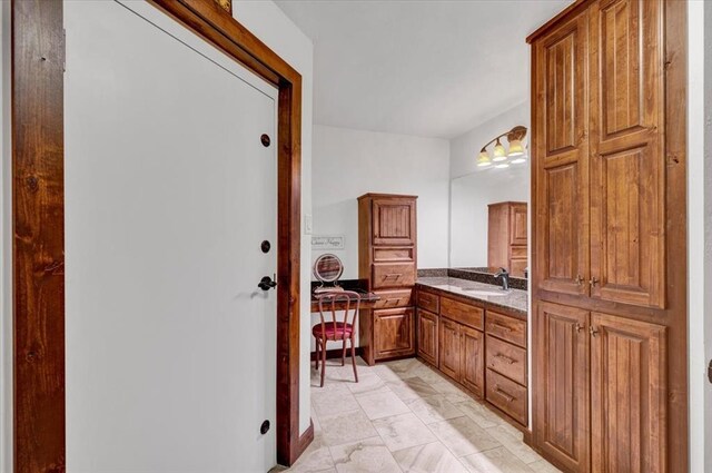 2801 John Deere Ave Unit 1, Edmond, OK 73034 - bathroom featuring vanity and marble look tile flooring