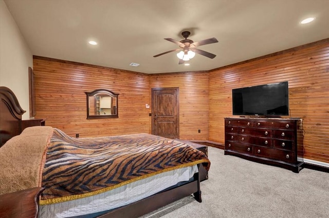 2801 John Deere Ave Unit 1, Edmond, OK 73034 - carpeted bedroom featuring wood walls, recessed lighting, a ceiling fan, and baseboards